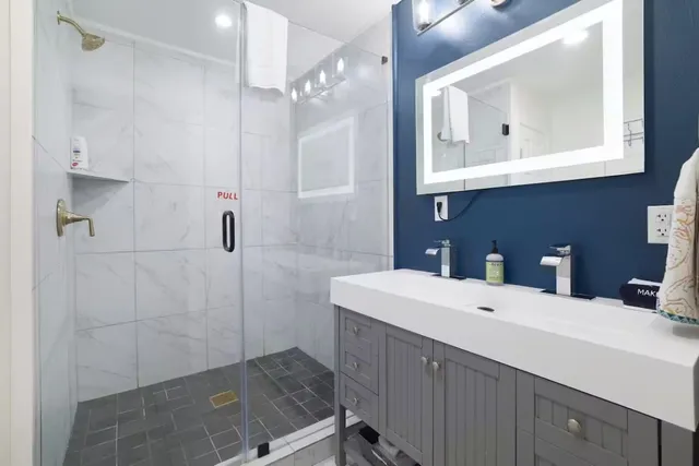 a bedroom with a bed and a mirror