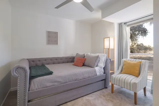 a bathroom with a sink mirror and shower