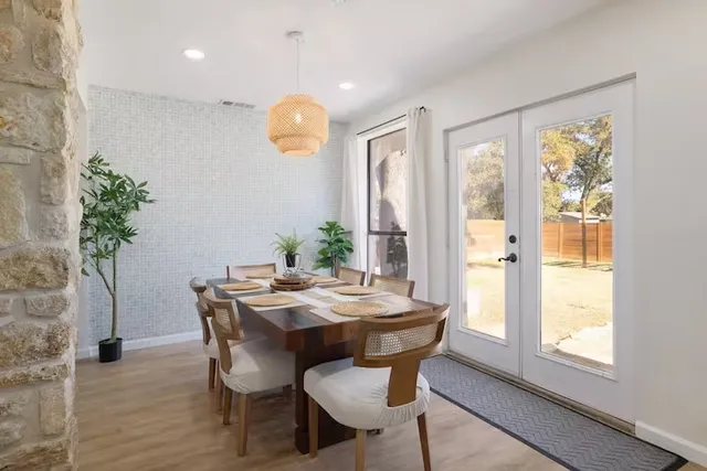 a view of a dining room with furniture and window