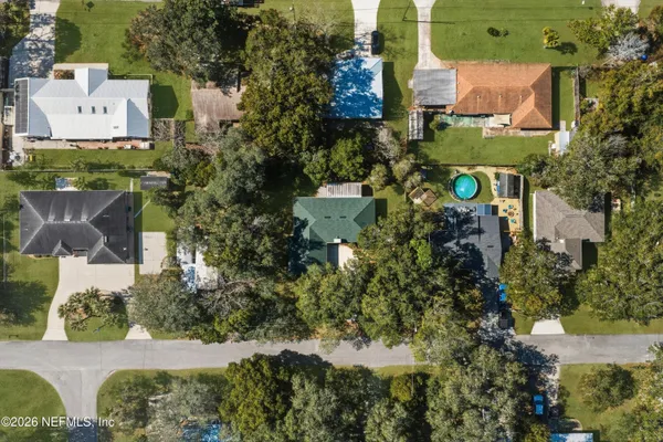 an aerial view of a house with a garden