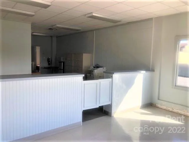 a kitchen with a sink and a refrigerator