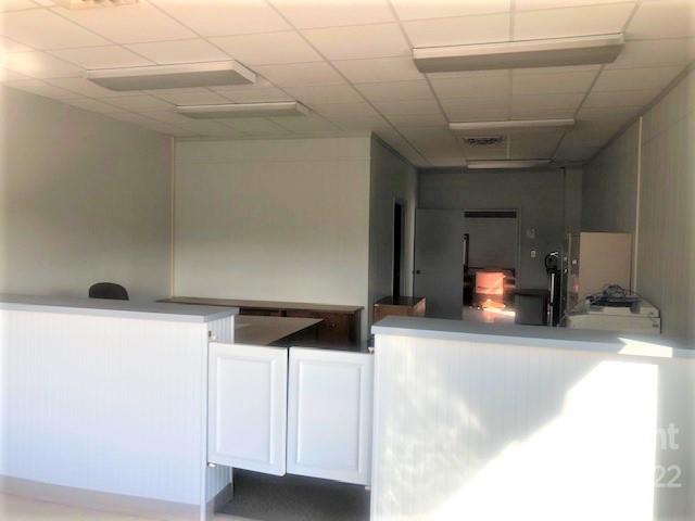 360 1st Avenue Southwest, Unit A Hickory, NC 28602 - Photo 6 of 14 a kitchen with a sink and a refrigerator