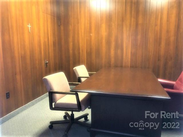 360 1st Avenue Southwest, Unit A Hickory, NC 28602 - Photo 9 of 14 a room with a table chair and lamp