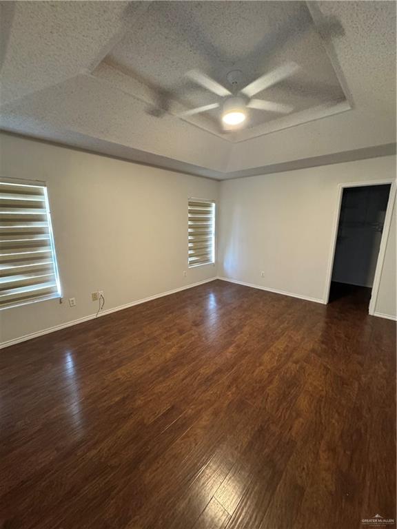 4110 Santa Fabiola Mission, TX 78572 - Photo 6 of 11 an empty room with wooden floor and windows