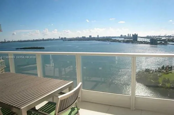 a view of a balcony with an ocean view