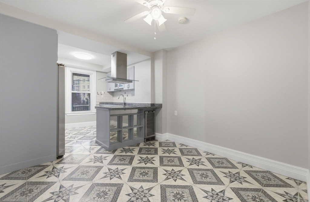 20 Bennett Street, Unit 1L Beverly, MA 01915 - Photo 22 of 22 a dining room with a table and chairs