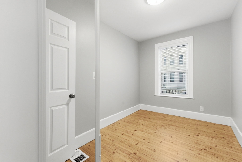20 Bennett Street, Unit 1L Beverly, MA 01915 - Photo 9 of 22 an empty room with a window