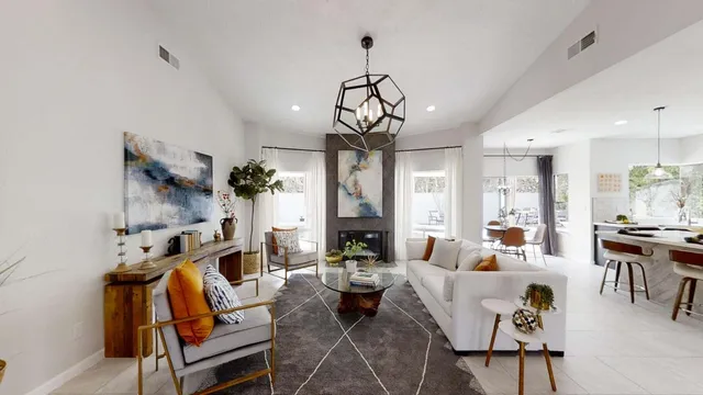 a living room with furniture chandelier and a chandelier