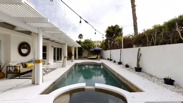 a view of a swimming pool with seating area