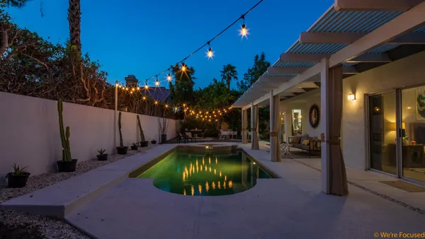 a view of a swimming pool with patio
