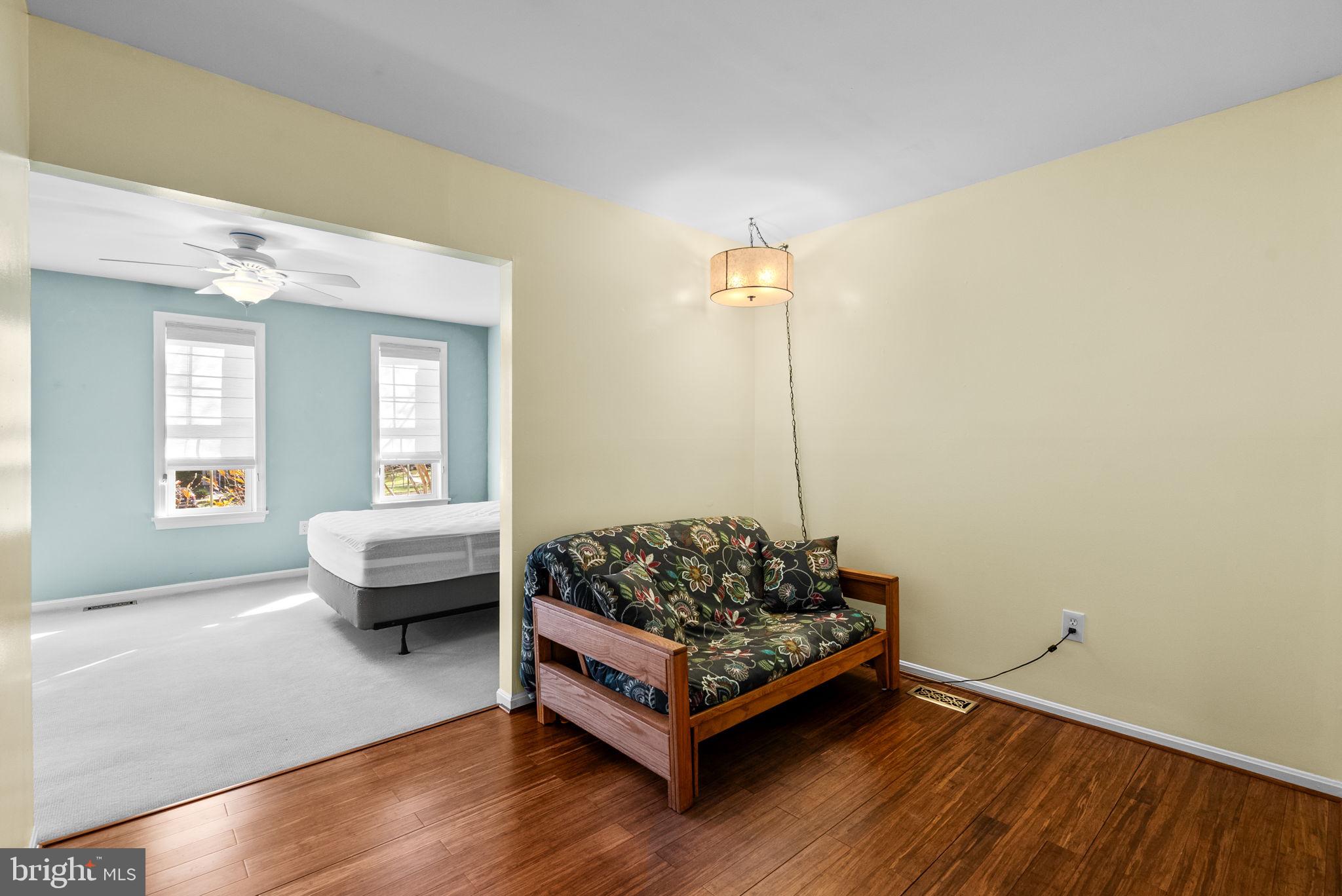 12633 English Orchard Court Silver Spring, MD 20906 - Photo 19 of 45 a living room with furniture and a wooden floor