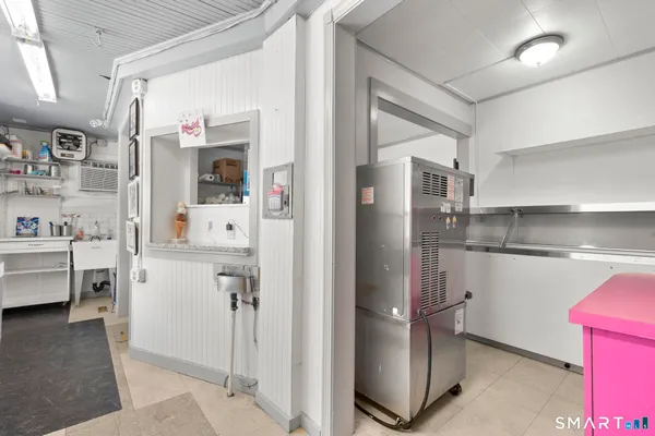 a kitchen with stainless steel appliances a refrigerator sink and cabinets
