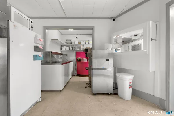 a utility room with cabinets dryer and washer