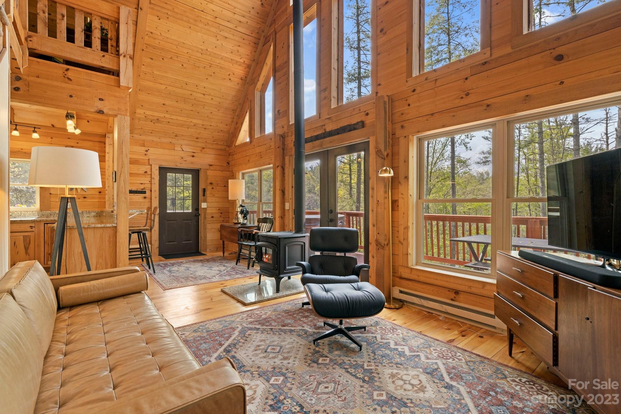 2023 Turnpike Road Marshall, NC 28753 - Photo 12 of 47 a living room with furniture fireplace and flat screen tv