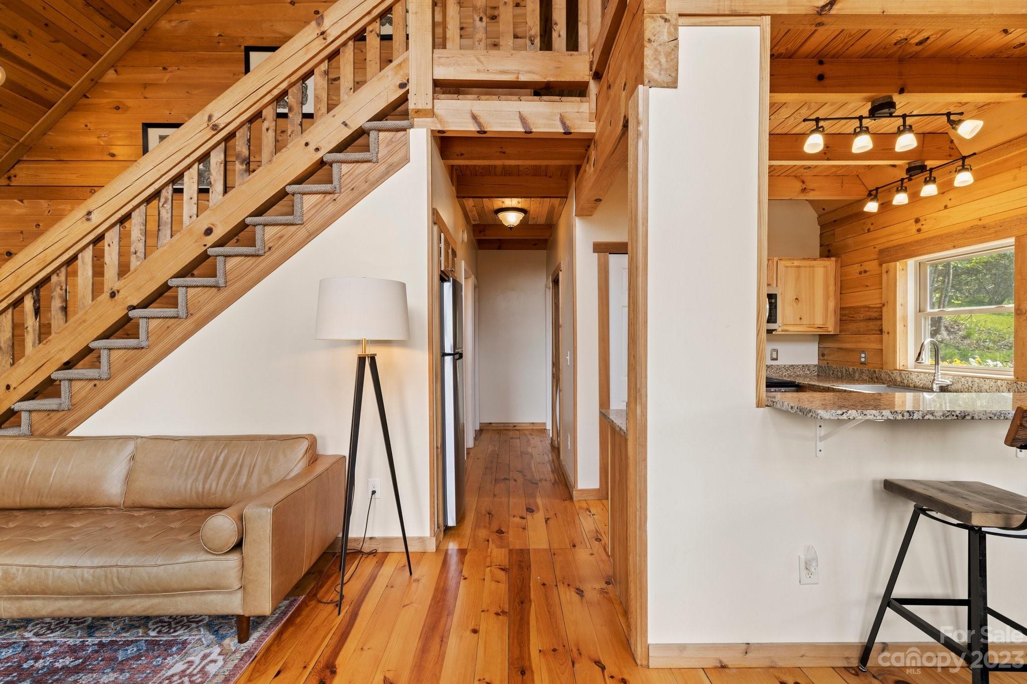 2023 Turnpike Road Marshall, NC 28753 - Photo 14 of 47 a view of entryway and hall with wooden floor