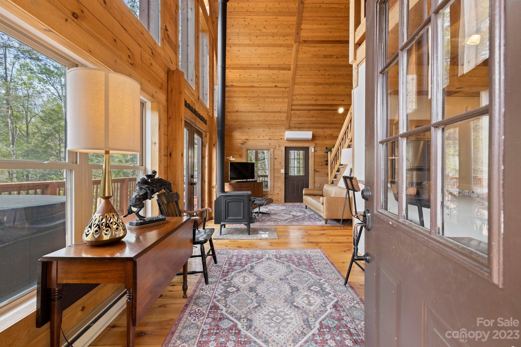 2023 Turnpike Road Marshall, NC 28753 - Photo 17 of 47 a living room with fireplace furniture and a large window