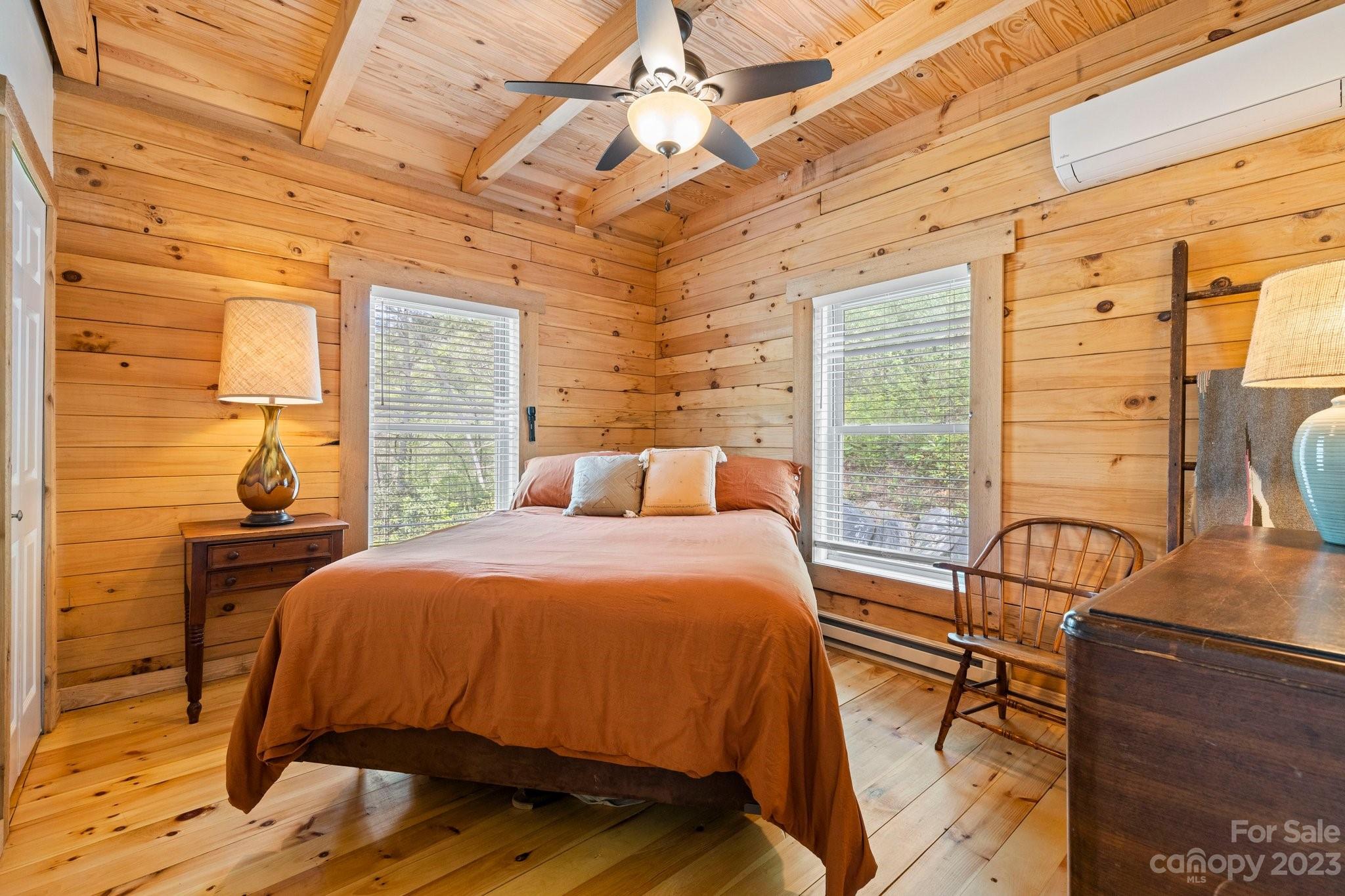 2023 Turnpike Road Marshall, NC 28753 - Photo 23 of 47 a bedroom with a bed a table and chair