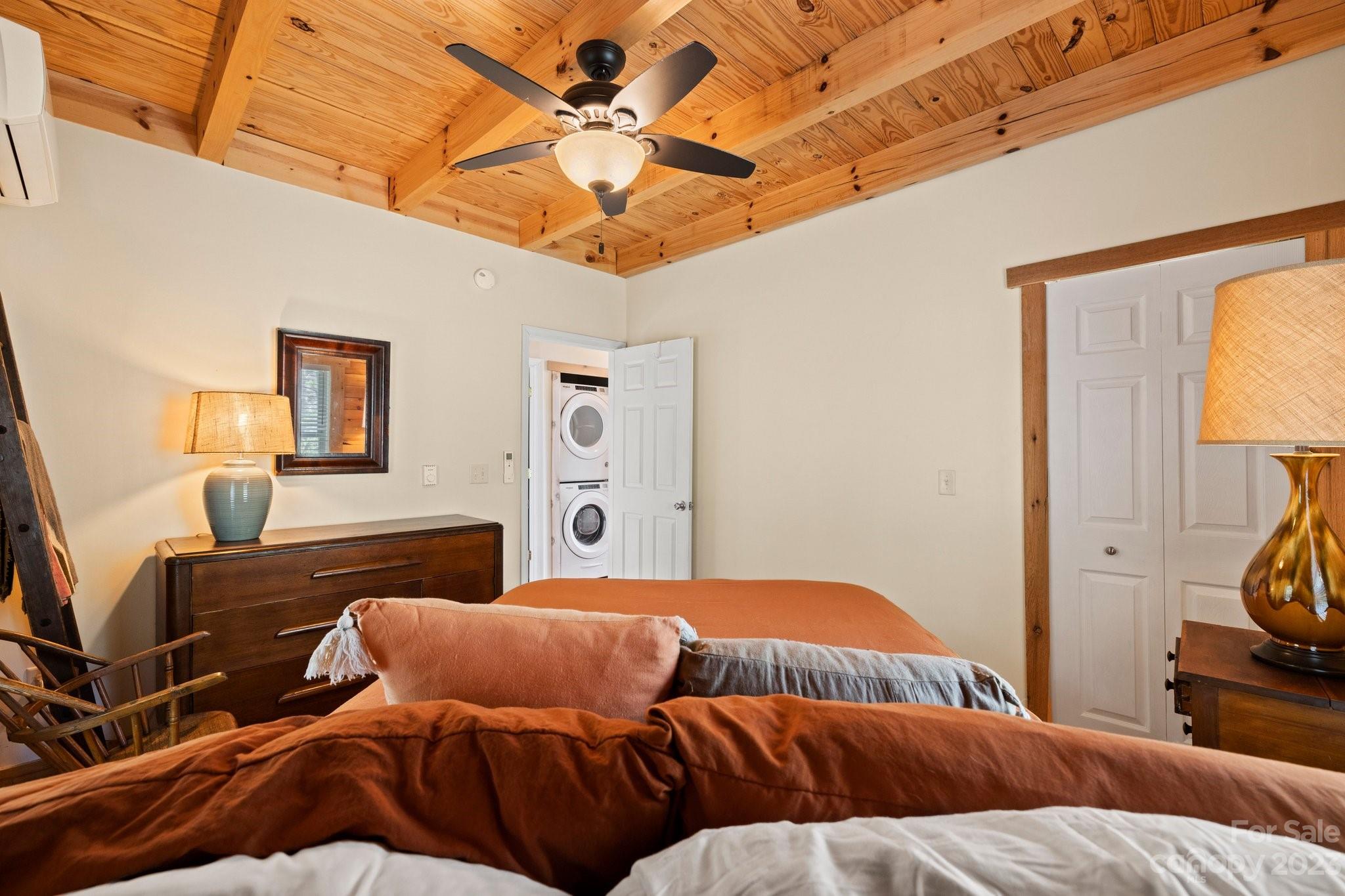 2023 Turnpike Road Marshall, NC 28753 - Photo 24 of 47 a bedroom with a bed and wooden floor