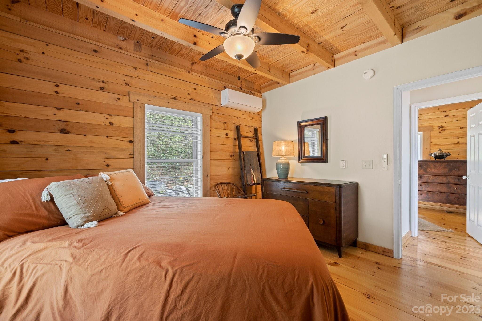 2023 Turnpike Road Marshall, NC 28753 - Photo 25 of 47 a bedroom with a bed and wooden floor