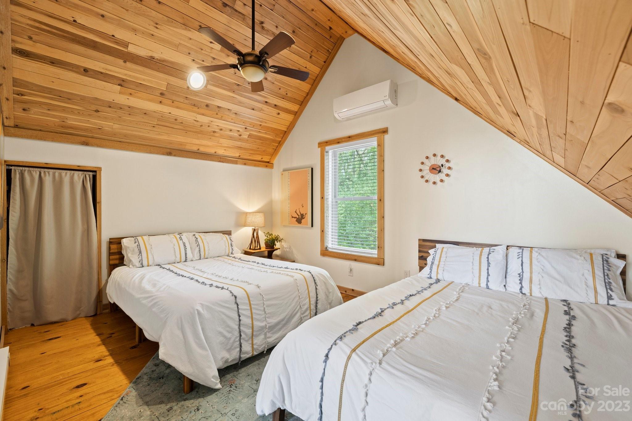 2023 Turnpike Road Marshall, NC 28753 - Photo 31 of 47 a bedroom with two beds and a window