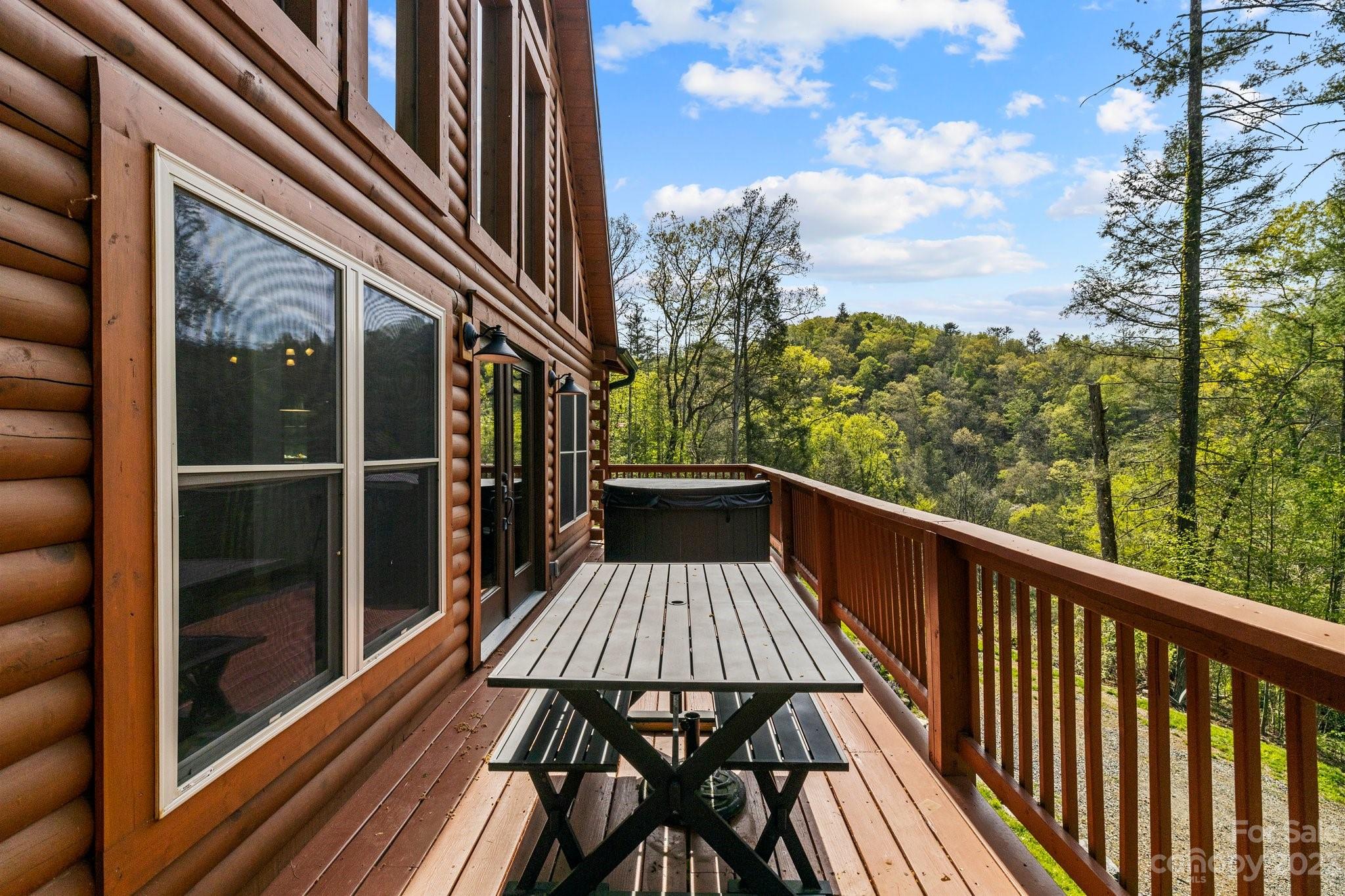 2023 Turnpike Road Marshall, NC 28753 - Photo 33 of 47 a view of a balcony with wooden floor and fence