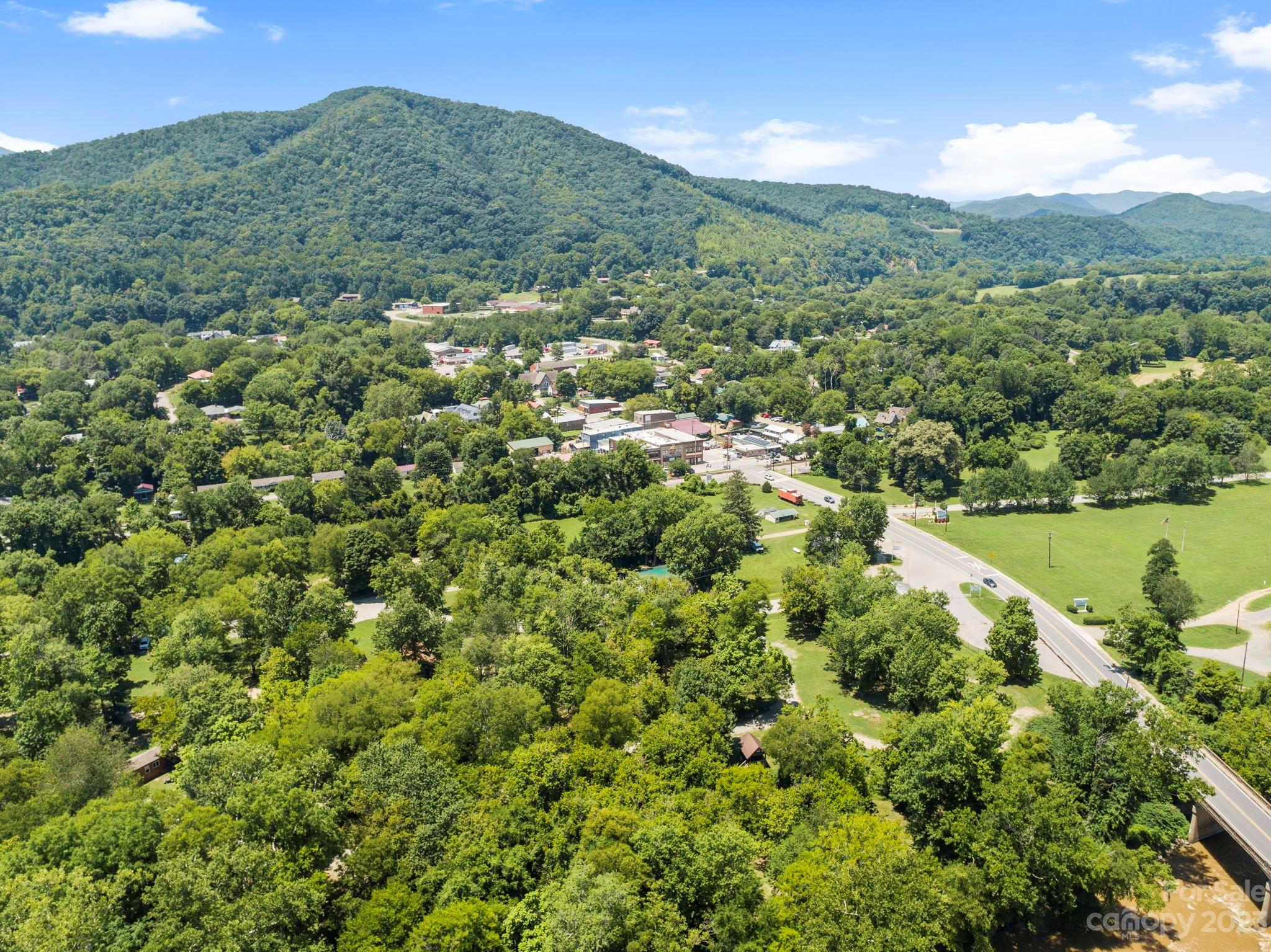 2023 Turnpike Road Marshall, NC 28753 - Photo 47 of 47 a view of a lush green field with mountains in the background