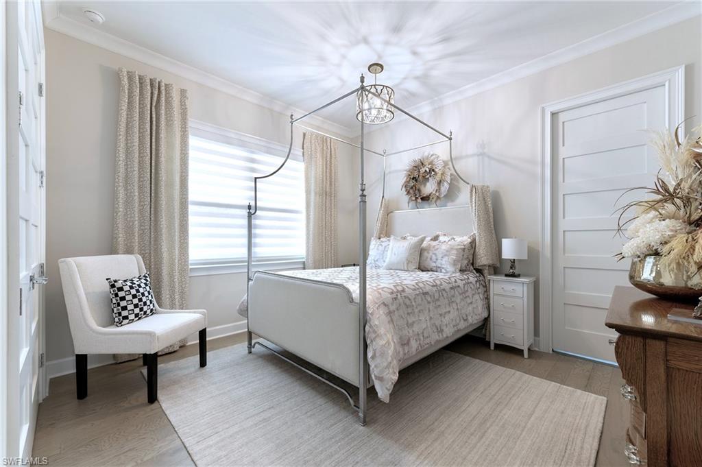 8914 Gustavia Court Naples, FL 34113 - Photo 8 of 23 a bedroom with a bed and a window
