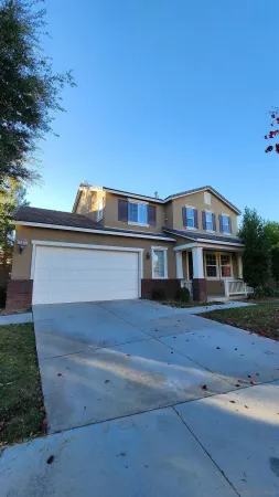 a view of house with yard