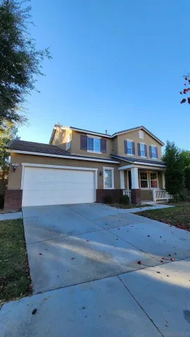 a view of house with yard