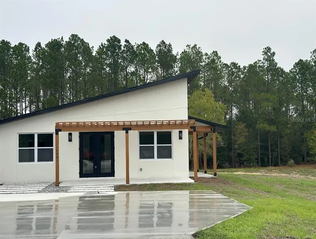 a house with trees in the background