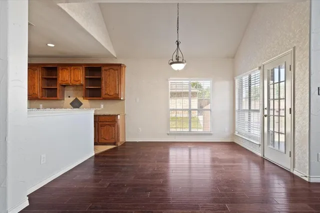 a view of a kitchen with a sink and a window