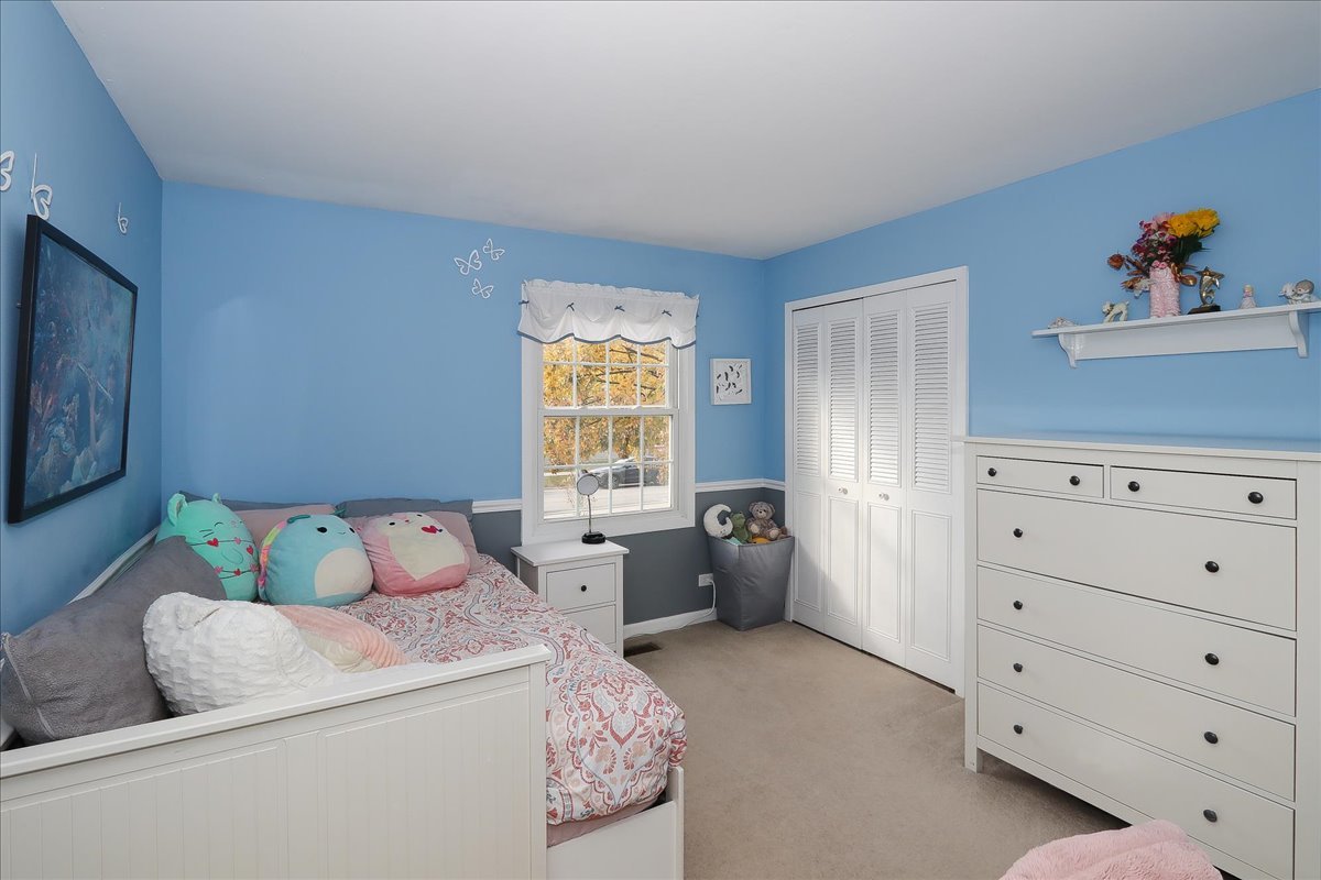 760 Checker Drive Buffalo Grove, IL 60089 - Photo 15 of 29 a bed room with a bed and a window