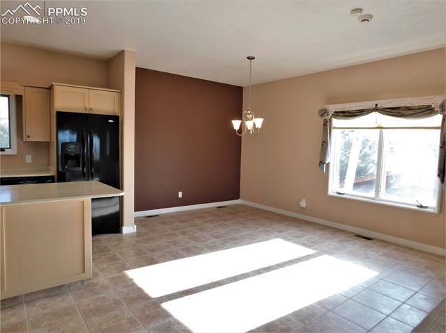 4320 Meridian Road Peyton, CO 80831 - Photo 6 of 28 Dining area w ceramic tile