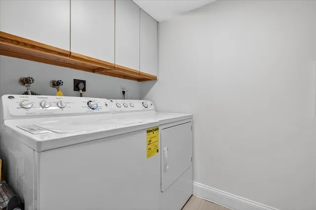 a utility room with washer and dryer