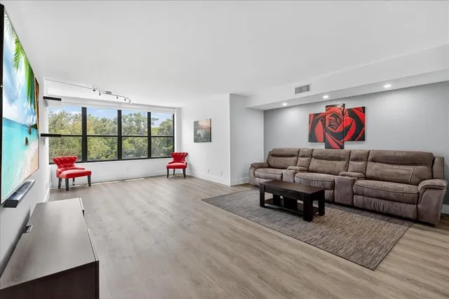 a living room with furniture and window