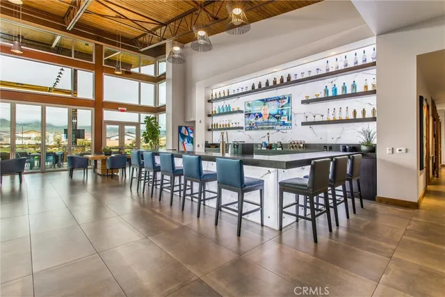 a outdoor space with the couches and dining table with the garden view