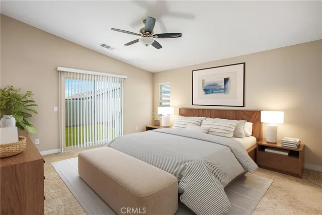 a bedroom with a large bed and a window