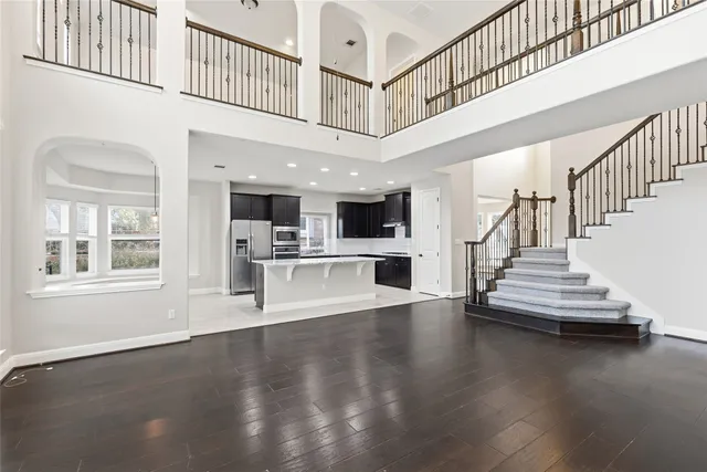 a view of an entryway with wooden floor