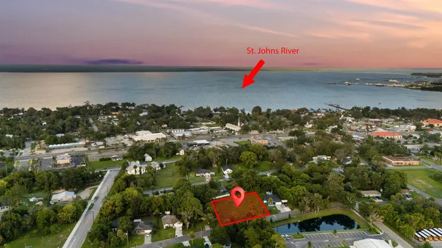 an aerial view of a houses with a yard