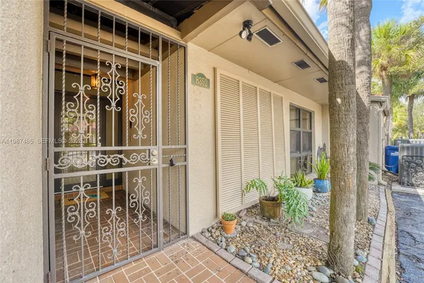 a kitchen with stainless steel appliances granite countertop a stove a microwave and a refrigerator