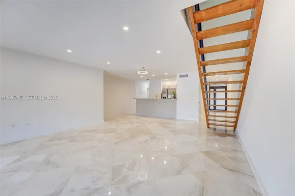 a spacious bathroom with a large tub and sink