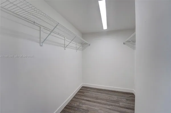 a bathroom with a granite countertop sink mirror and double