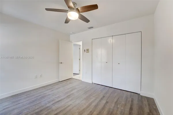 a view of an empty room with a large window