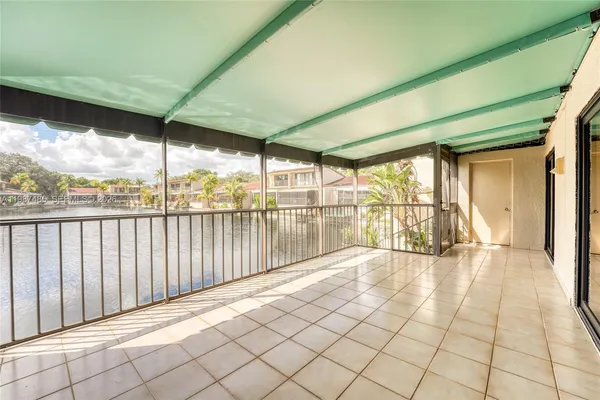 an aerial view of residential house with outdoor space and lake view