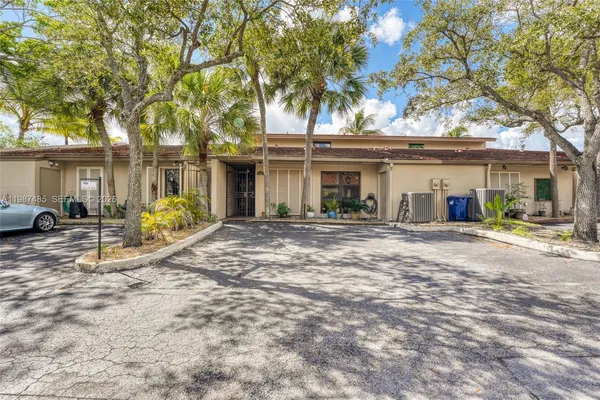 a view of a city with lots of residential buildings and mountain view in back