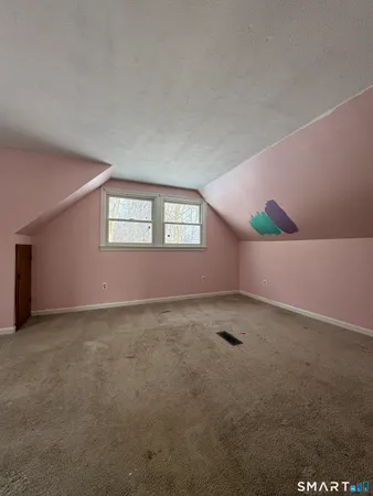 a view of an empty room with windows