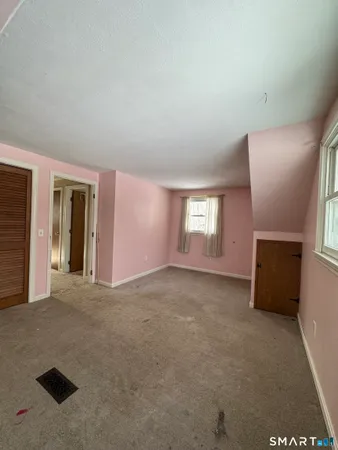 a view of a big room with windows and cabinet