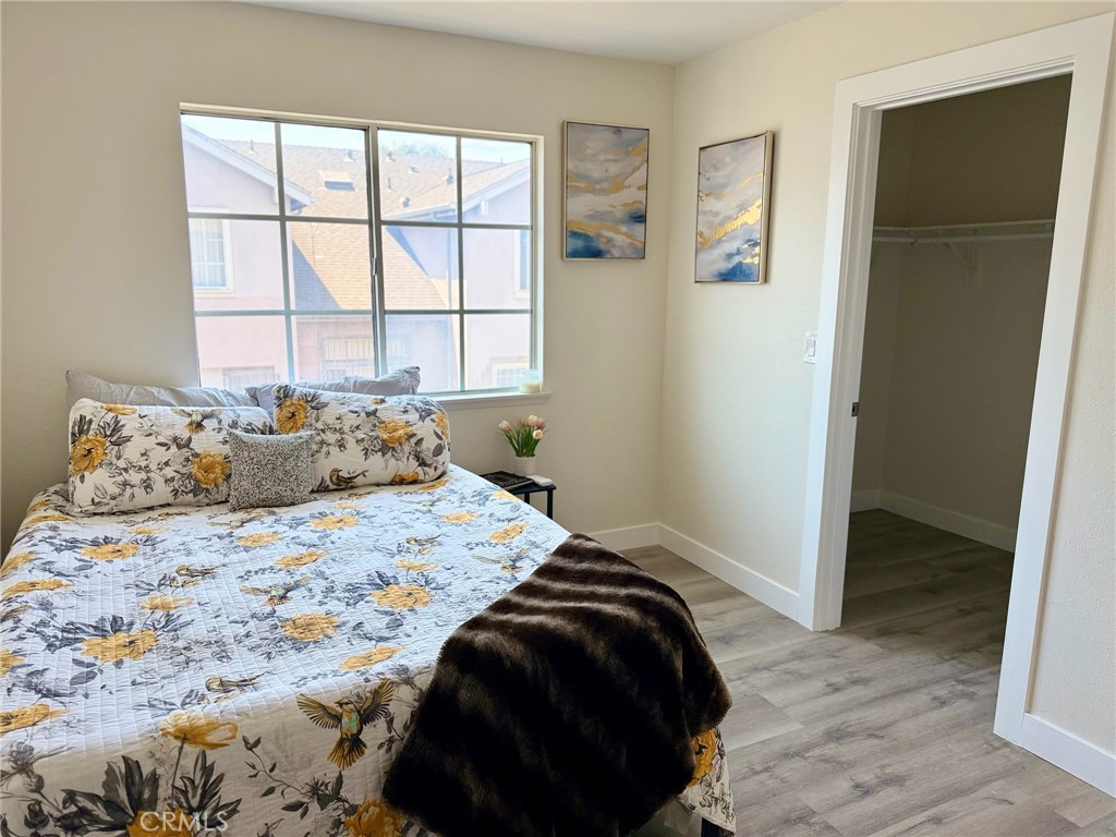 810 West Compton Boulevard, Unit 7 Compton, CA 90220 - Photo 8 of 16 a bedroom with a bed and a window