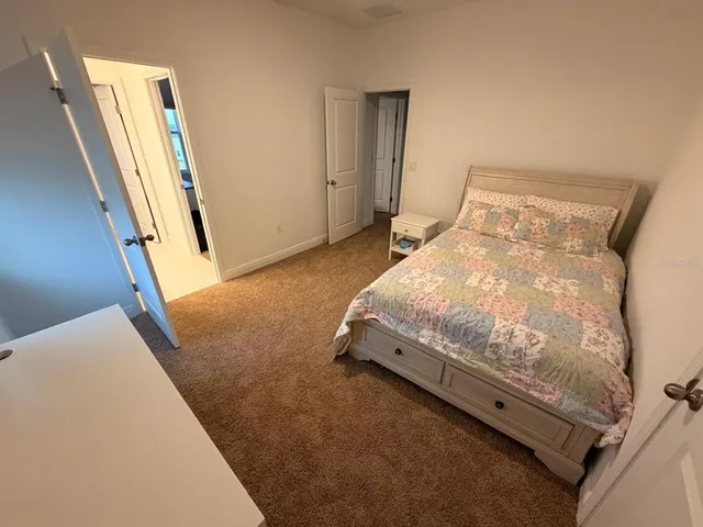 a white toilet sitting next to a shower curtain