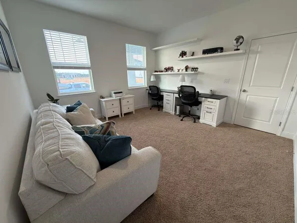 a living room with furniture and window